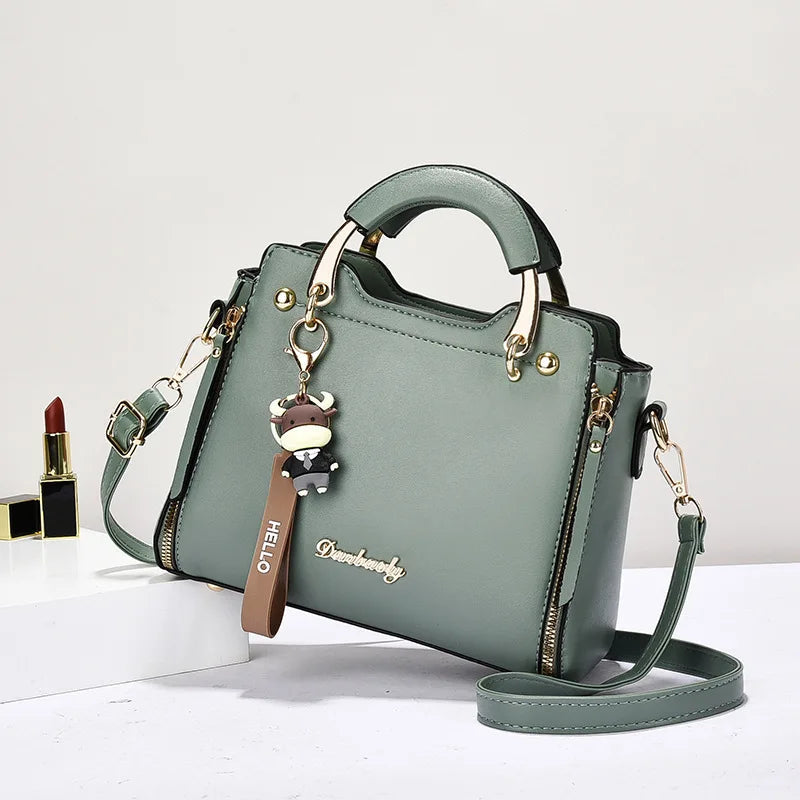 Printed monogram straddle leather bag. - Maison Novaire #